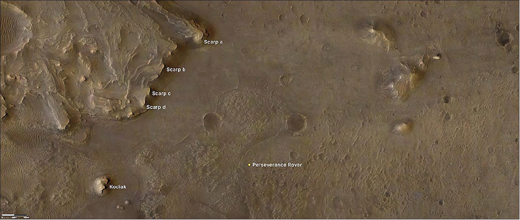 Figure 4: This overhead view of part of Jezero Crater comes from NASA's Mars Reconnaissance Orbiter. The Perseverance rover is located at center bottom. Kodiak Butte is to the lower left, and scarps (labeled a–d) along the delta are on the upper left (image credit: NASA/JPL-Caltech/University of Arizona/USGS)