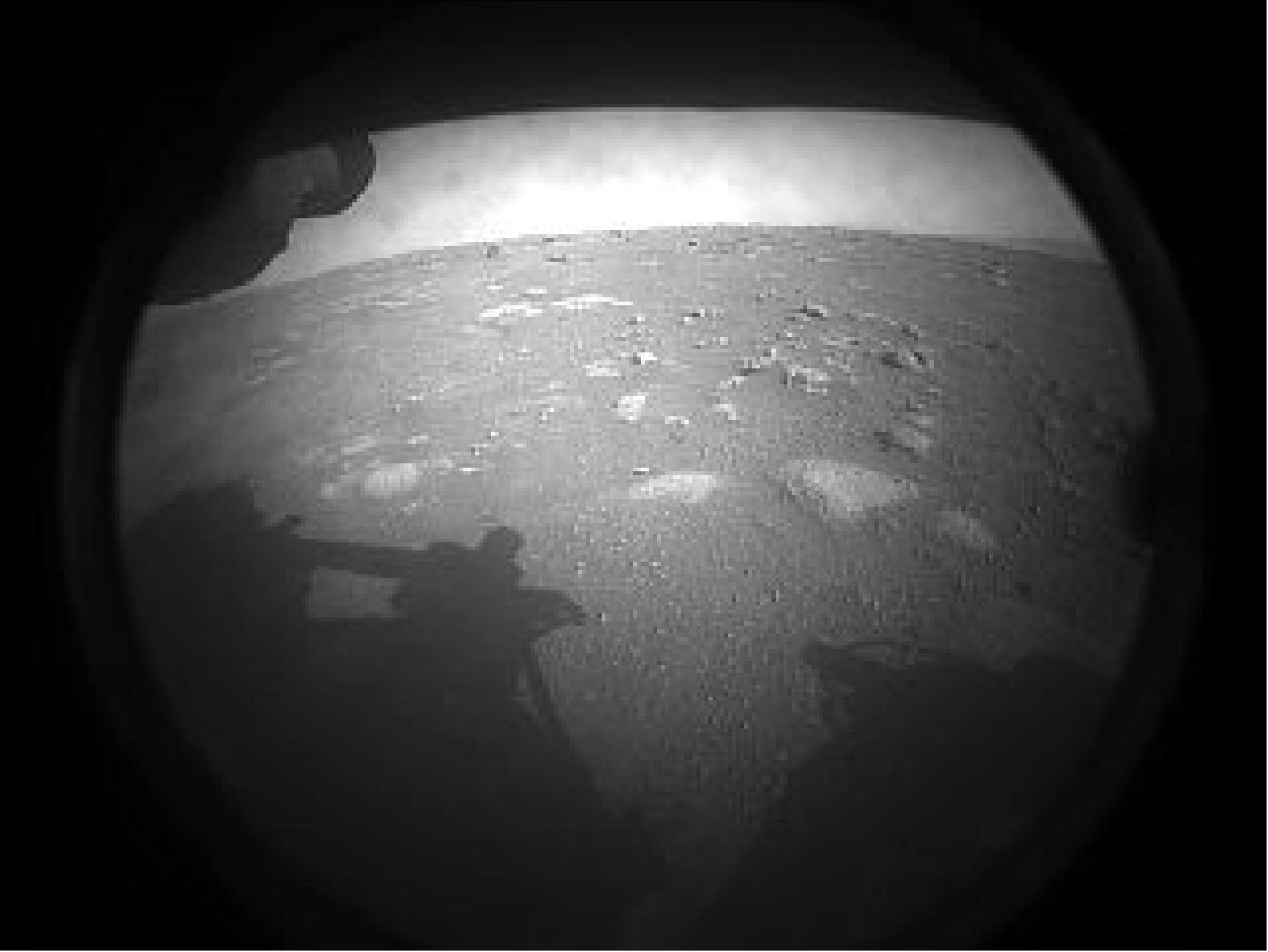 Figure 47: This is the first image NASA's Perseverance rover sent back after touching down on Mars on 18 February 2021. The view, from one of Perseverance's Hazard Cameras, is partially obscured by a dust cover (image credit: NASA/JPL-Caltech)