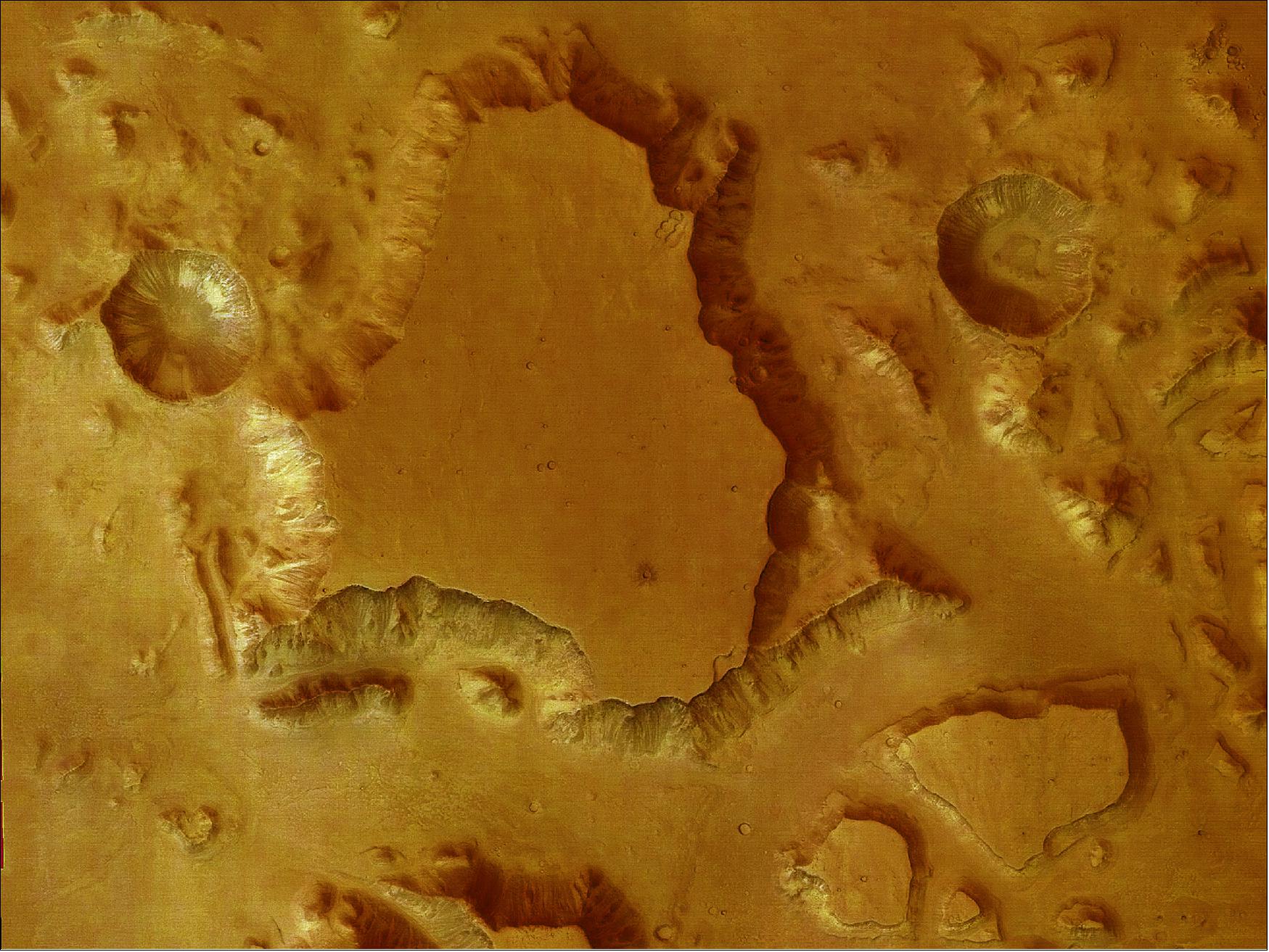 Figure 93: This picture was taken by the HRSC onboard ESA's Mars Express orbiter, in color and 3D, in orbit 18 on 14 January 2004. It shows a vertical view of a mesa in the true colours of Mars. The summit plateau stands about 3 km above the surrounding terrain. The original surface was dissected by erosion, only isolated mesas remained intact. The large crater has a diameter of 7.6 km (image credit: ESA/DLR/FU Berlin (G. Neukum), CC BY-SA 3.0 IGO) 45)
