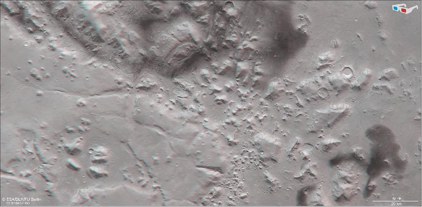 Figure 68: This image shows Nil Fossae, an escarpment sitting between the northern lowlands and southern highlands of Mars, in 3D when viewed using red-green or red-blue glasses. This anaglyph was derived from data obtained by the nadir channel and one stereo channel of the High Resolution Stereo Camera (HRSC) on ESA’s Mars Express during spacecraft orbit 17916. It covers a part of the martian surface centered on 78ºE, 28ºN. North is to the right (image credit: ESA/DLR/FU Berlin, CC BY-SA 3.0 IGO)