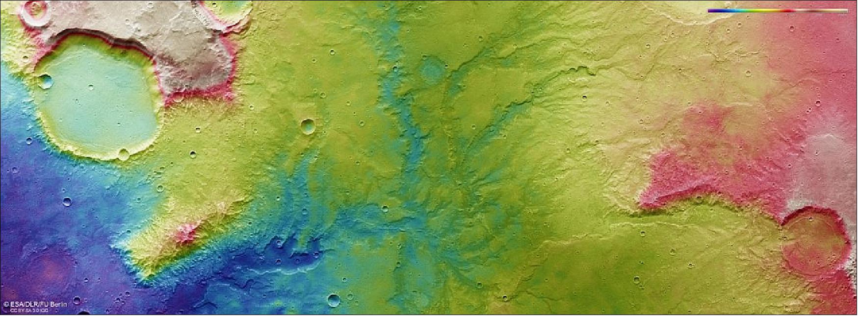 Figure 56: This color-coded topographic view shows the relative heights of the terrain in and around a network of dried-up valleys on Mars. Lower parts of the surface are shown in blues and purples, while higher altitude regions show up in whites, yellows, and reds, as indicated on the scale to the top right. This view is based on a digital terrain model of the region, from which the topography of the landscape can be derived. It comprises data obtained by the High Resolution Stereo Camera on Mars Express on 19 November 2018 during Mars Express orbit 18831. The ground resolution is approximately 14 m/pixel and the images are centered at 66°E/17°S. North is to the right (image credit: ESA/DLR/FU Berlin, CC BY-SA 3.0 IGO)