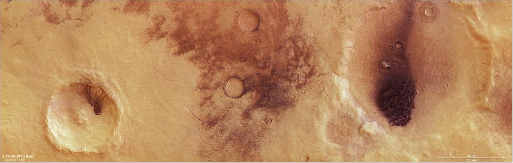Figure 46: This image from ESA's Mars Express shows Chalcoporos Rupes, a region on Mars that shows signs of dust and wind activity. It comprises data gathered on 3 January 2019 during Mars Express Orbit 18983. The ground resolution is approximately 13 m/pixel and the images are centered at about 23º East and 53º South. This image was created using data from the nadir and color channels of the High Resolution Stereo Camera (HRSC). The nadir channel is aligned perpendicular to the surface of Mars, as if looking straight down at the surface. North is to the right (image credit: ESA/DLR/FU Berlin, CC BY-SA 3.0 IGO)