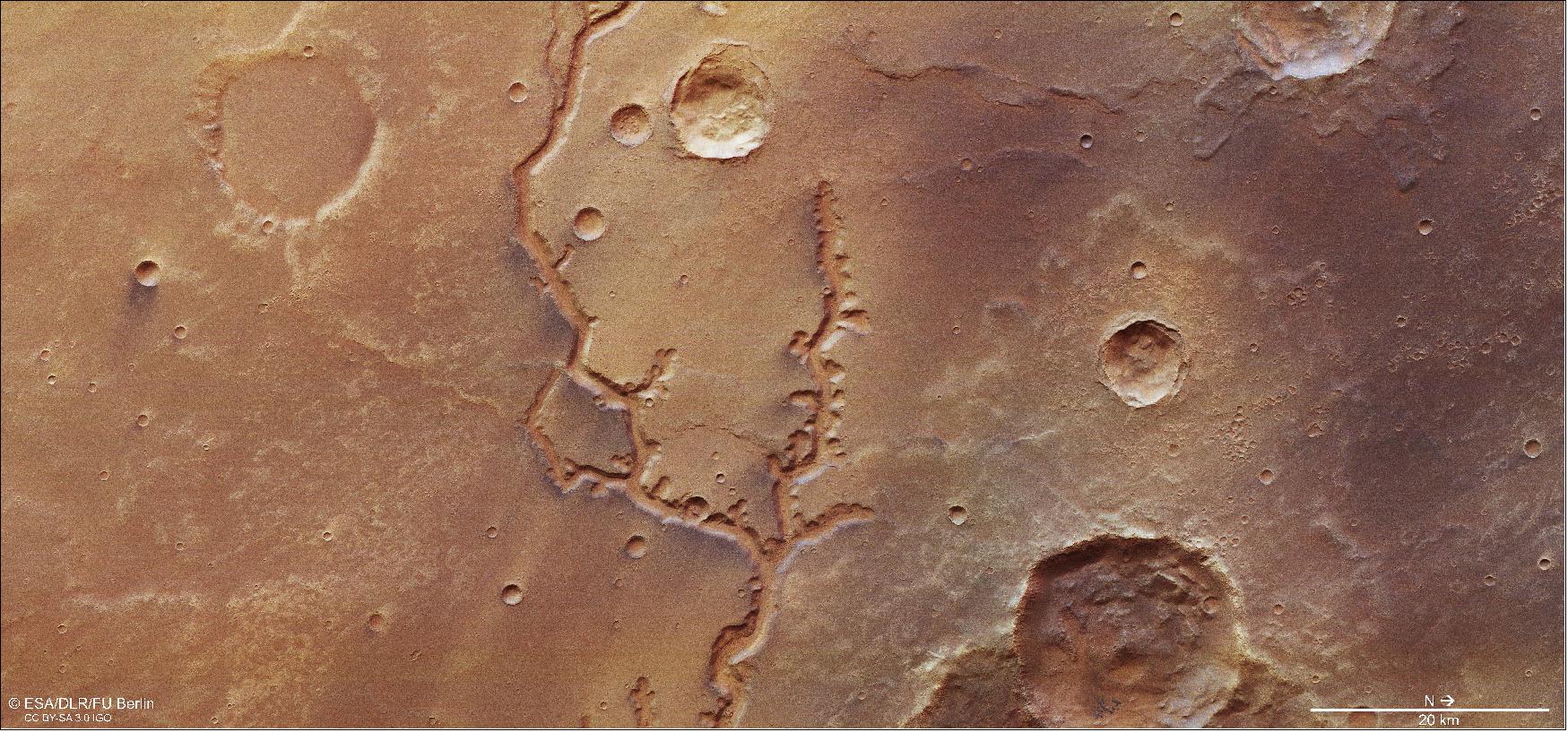 Figure 12: This image from ESA's Mars Express shows a dried-up river valley on Mars named Nirgal Vallis. It comprises data gathered on 16 November 2018 during Mars Express Orbit 18818. The ground resolution is approximately 14 m/pixel and the images are centered at about 315ºE/27ºS. This image was created using data from the nadir and color channels of the High Resolution Stereo Camera. The nadir channel is aligned perpendicular to the surface of Mars, as if looking straight down at the surface. North is to the right (image credit: ESA/DLR/FU Berlin, CC BY-SA 3.0 IGO)