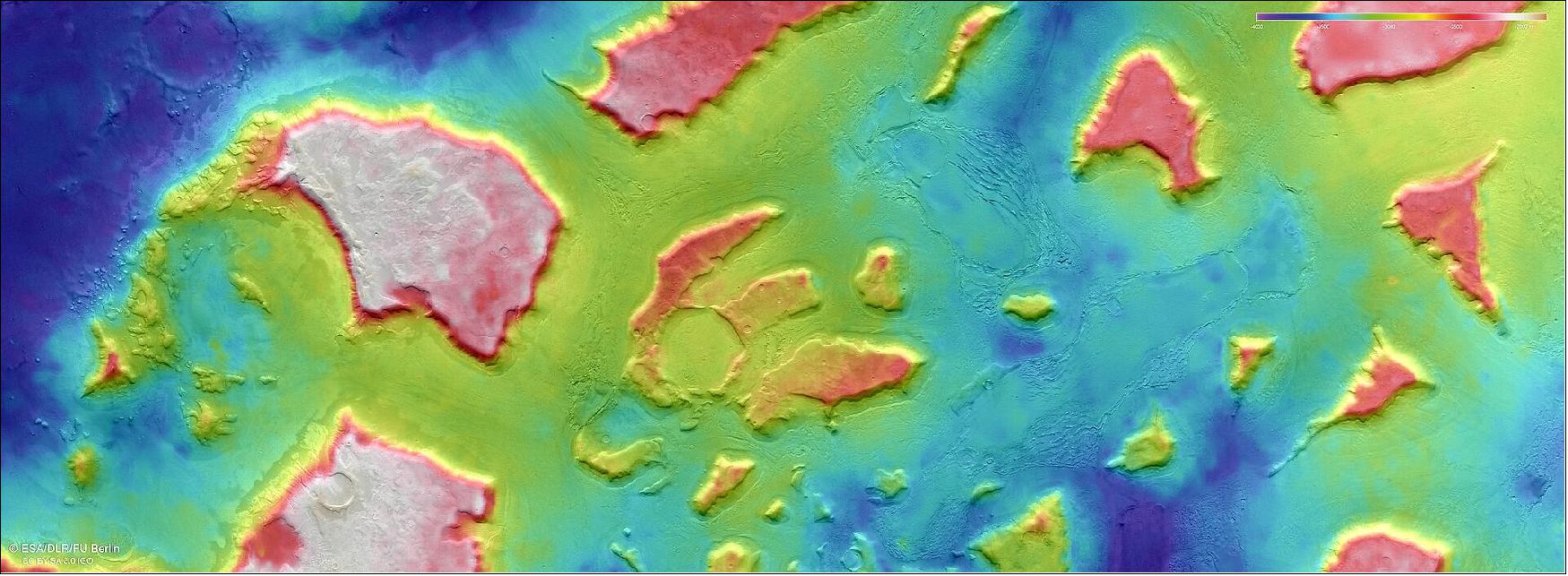 Figure 5: This color-coded topographic view shows a region of Mars named Deuteronilus Mensae. Lower parts of the surface are shown in blues and purples, while higher altitude regions show up in whites, yellows and reds, as indicated on the scale to the top right. This view is based on a digital terrain model of the region, from which the topography of the landscape can be derived. It comprises data gathered on 25 February 2018 during orbit 17913. The ground resolution is approximately 13 m/pixel and the images are centered at about 25.5ºE/44ºN. North is to the right (image credit: ESA/DLR/FU Berlin, CC BY-SA 3.0 IGO)