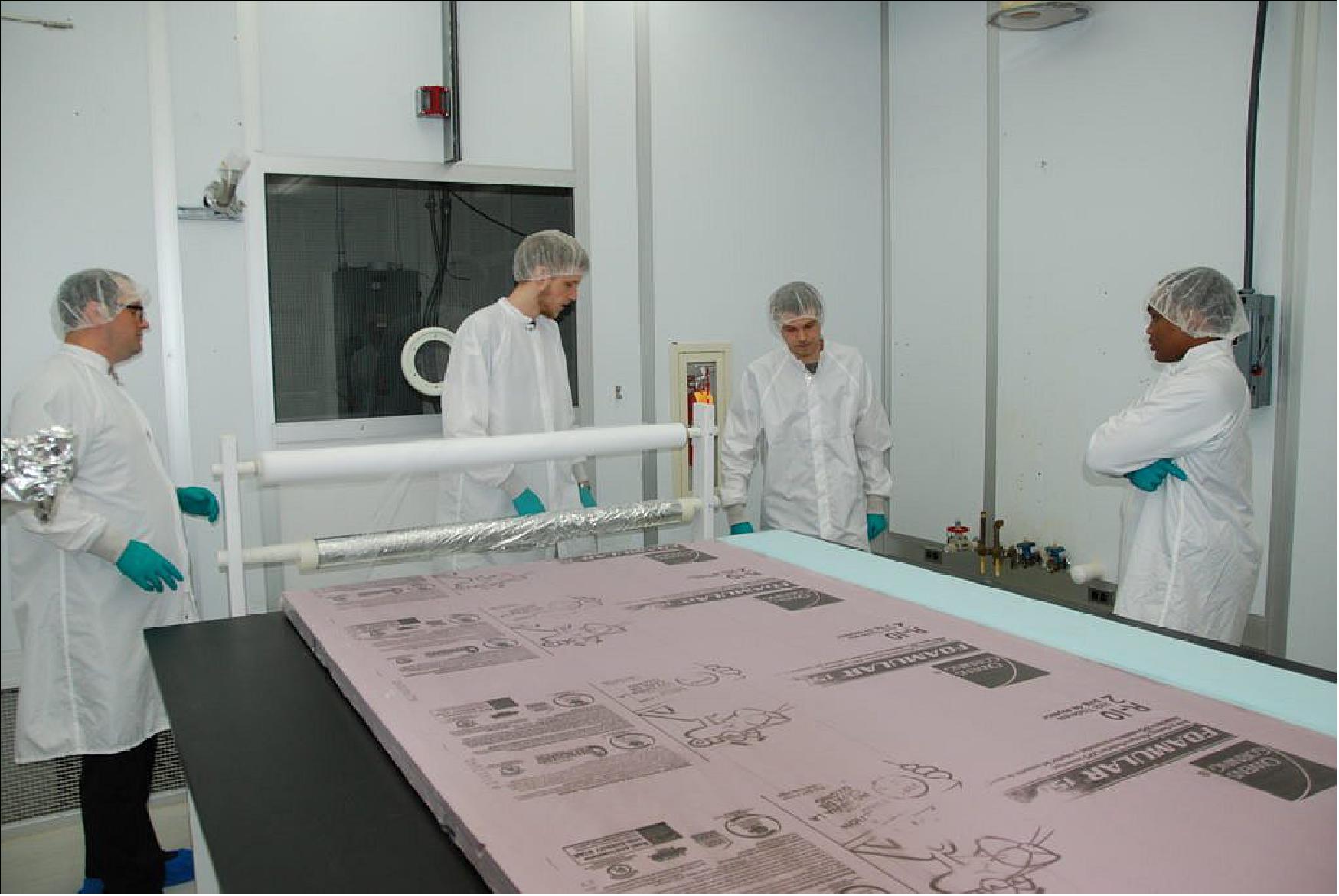 Figure 17: Gudmundur Stefansson supervises the assembly of an MLI blanket (image credit: PSU)