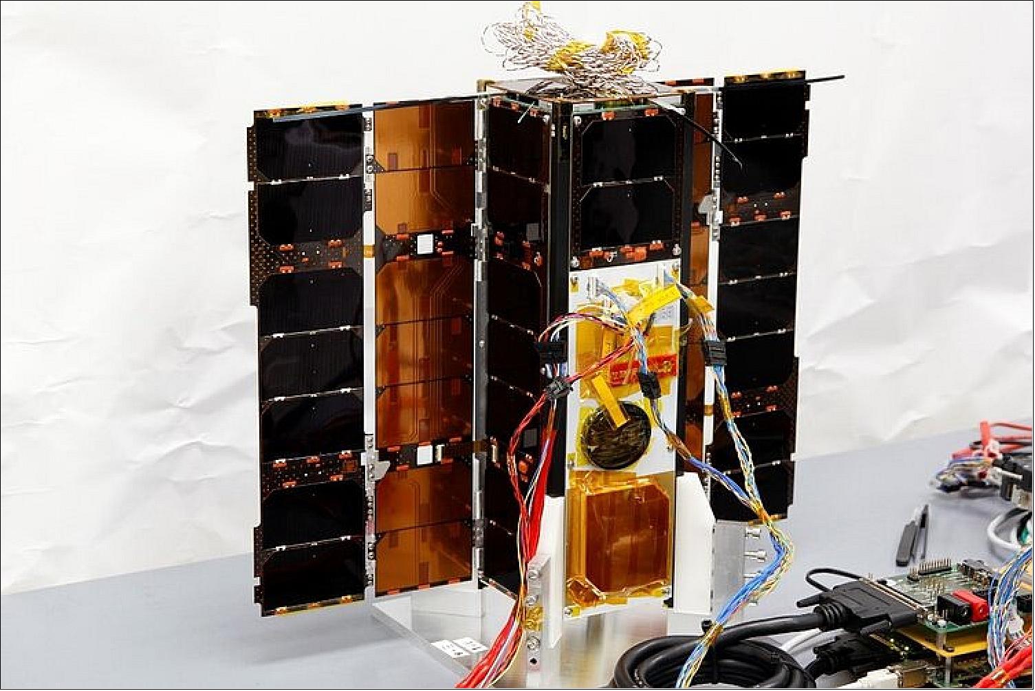 Figure 9: OPS-SAT during testing of its solar arrays at the Graz University of Technology, Austria (image credit: TU Graz)