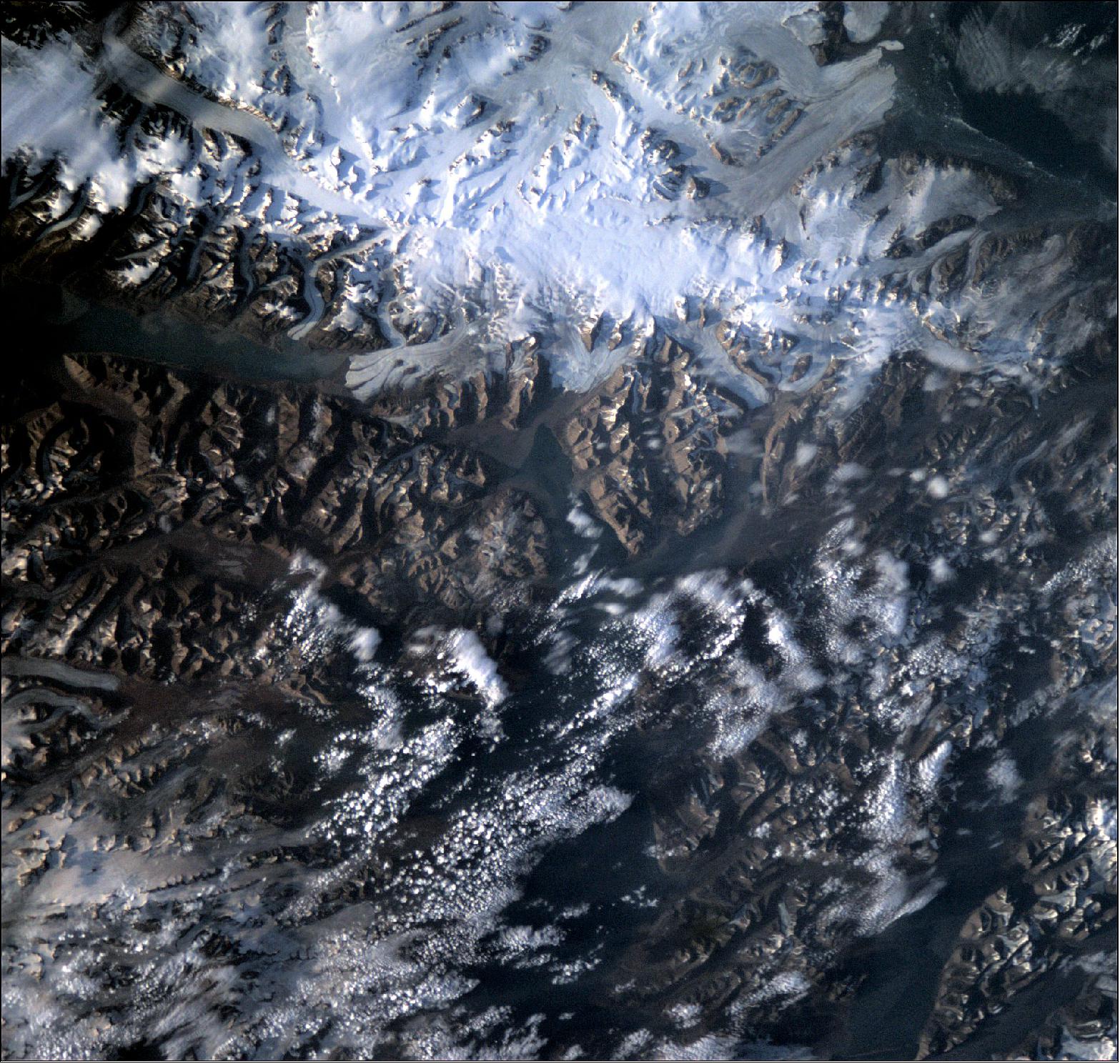 Figure 41: This photo was captured by OPS-SAT, ESA’s space laboratory, as it underwent commissioning of its high-definition camera on 26 July 2020. The rugged, remote terrain is one of the world's northernmost inhabited regions. A Norwegian archipelago in the Arctic Ocean, part way between Norway and the North Pole, Svalbard is made up of glaciers and frozen tundra. The nanosatellite managed to capture the beautiful detail of this unique region, including the long, horizontal body of water at the top-left of the image, the notorious 32 km long Austfjorden fjord of Svalbard (image credit: ESA) 46)