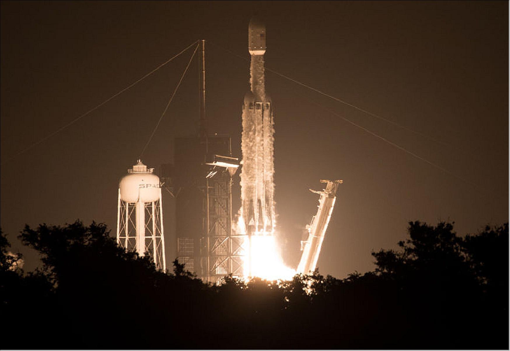 Figure 10: SpaceX's Falcon Heavy rocket, carrying OTB-1 and 23 other spacecraft for the U.S. Air Force's STP-2 mission, lifts off from Kennedy Space Center on 25 June 2019 at 06:30 UTC. The satellites include four NASA technology and science payloads that will study non-toxic spacecraft fuel, deep space navigation, "bubbles" in the electrically-charged layers of Earth's upper atmosphere, and radiation protection for satellites. (image credit: NASA) 14)