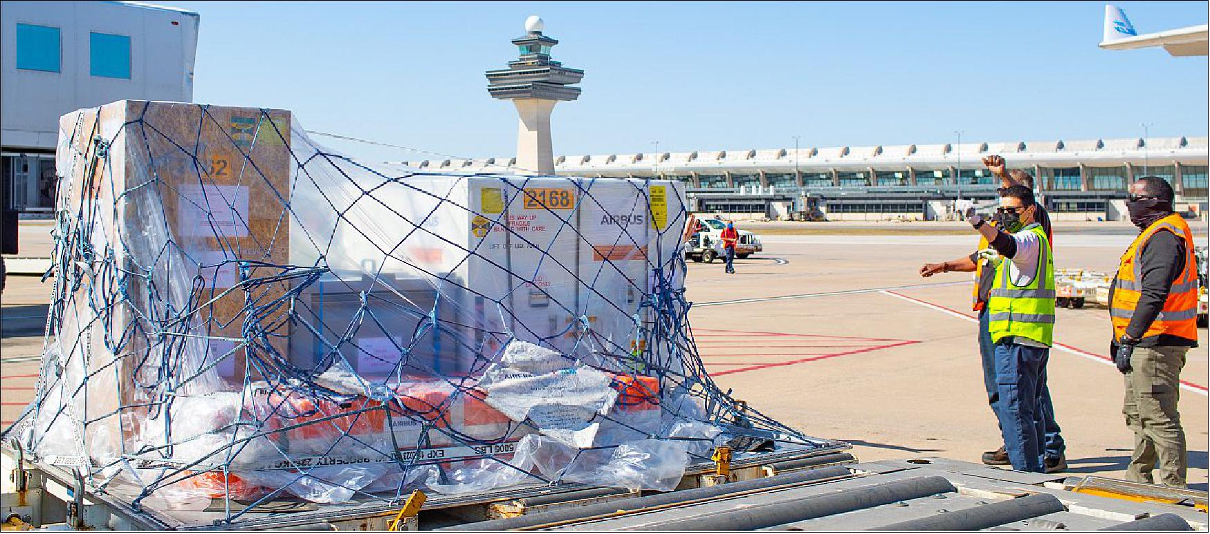 Figure 5: The SPEXone instrument is delivered and taken off the plane at Dulles International Airport (photo credit: Micheal Starobin/NASA)