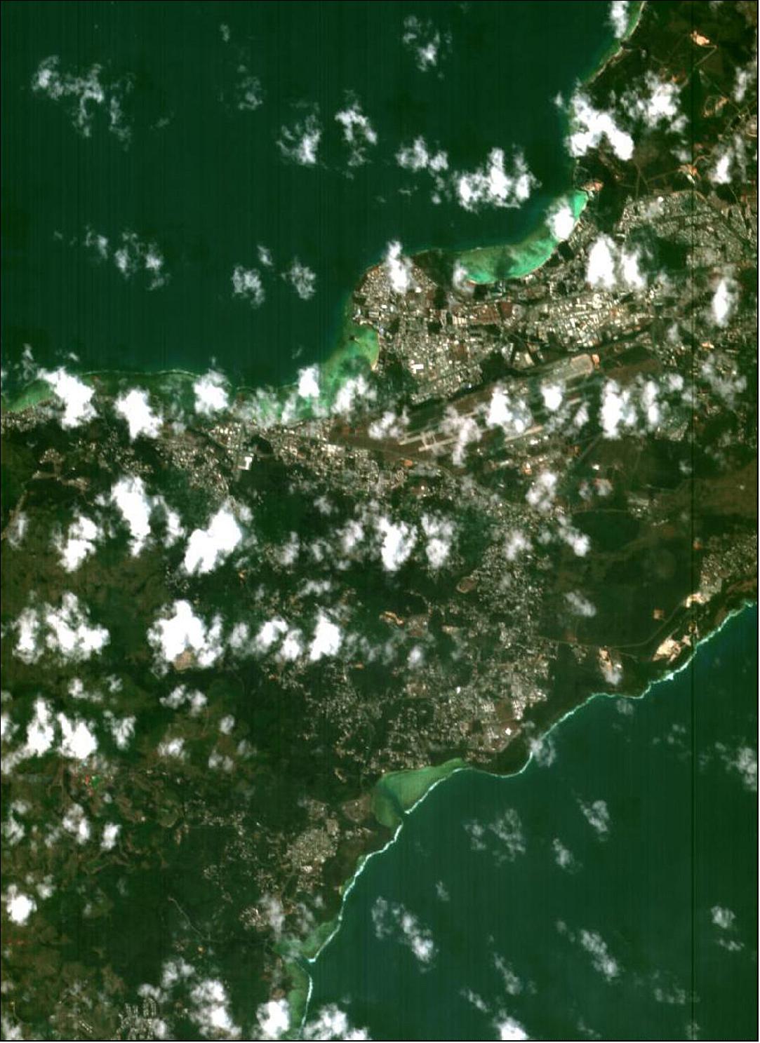 Figure 8: This image of PROBA-1 was acquired on 22 March 2018. The Antonio B. Won Pat International Airport is visible just right of center. To the north is the town of Tamuning and the bluish, coral-rich shores of Tumon Bay, with the capital Hagåtña to the west (image credit: ESA, CC BY-SA 3.0 IGO)