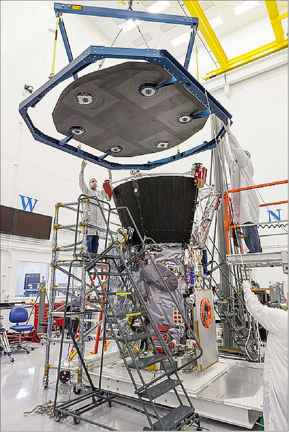 Figure 130: On 21 Sept. 2017, engineers at JHU/APL in Laurel, Maryland, lowered the thermal protection system – the heat shield – onto the spacecraft for a test of alignment as part of integration and testing (image credit: NASA/JHUAPL)