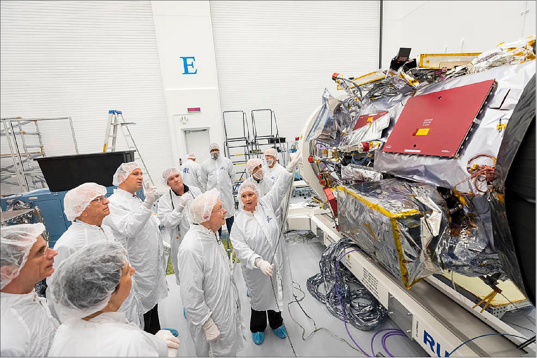 Figure 127: Eugene Parker, professor emeritus at the University of Chicago, visits the spacecraft that bears his name, NASA’s Parker Solar Probe, on Oct. 3, 2017. Engineers in the clean room at the Johns Hopkins Applied Physics Laboratory in Laurel, Maryland, where the probe was designed and built, point out the instruments that will collect data as the mission travels directly through the Sun’s atmosphere (image credit: NASA, JHU/APL)