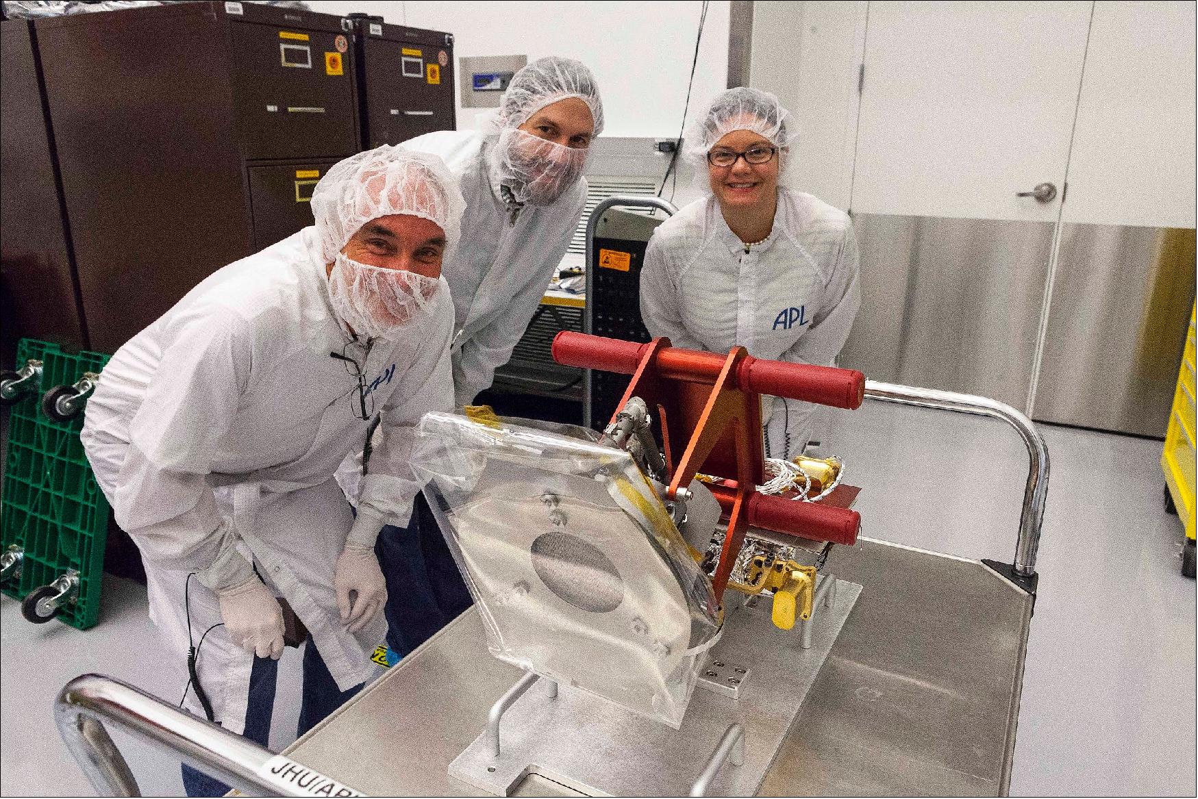 Figure 31: From left to right: Chris Scholz (University of California, Berkeley), Tony Case (Smithsonian Astrophysical Observatory), and NASA Program Scientist Kelly Korreck with the Solar Wind Electrons Alphas and Protons (SWEAP) cup just before it was integrated onto Parker Solar Probe (image credit: JHU/APL)
