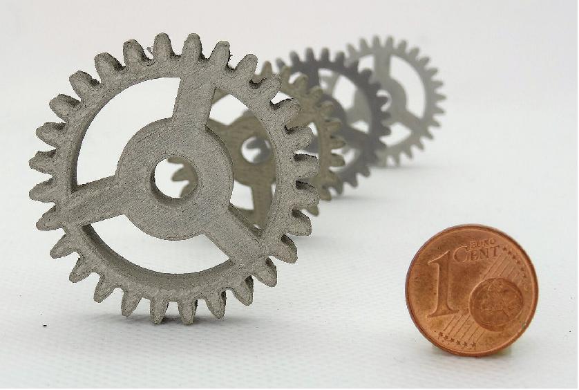Figure 1: Move over plastic: desktop 3D printing in metal or ceramics. These spur gears – seen here with a euro cent coin for scale – have been produced in stainless steel to a space standard of quality using nothing more than an off-the-shelf desktop 3D printer. ESA-supported startup TIWARI Scientific Instruments in Germany has developed a technique allowing low cost 3D printing using a variety of metals and ceramics. Ordinarily producing precision parts in such high-performance materials would be costly in both time and money, but the company can instead shape them using standard 3D printing techniques. TIWARI’s FFF (Fused Filament Fabrication) print process uses thermoplastic filaments that are embedded with particles of the metal or ceramic the part is to be made from. Once the printing is finished, the part – known as a ‘green body’ – is put through a thermal treatment to eliminate the plastic, leaving behind a metal or ceramic item (image credit: TIWARI Scientific Instruments)