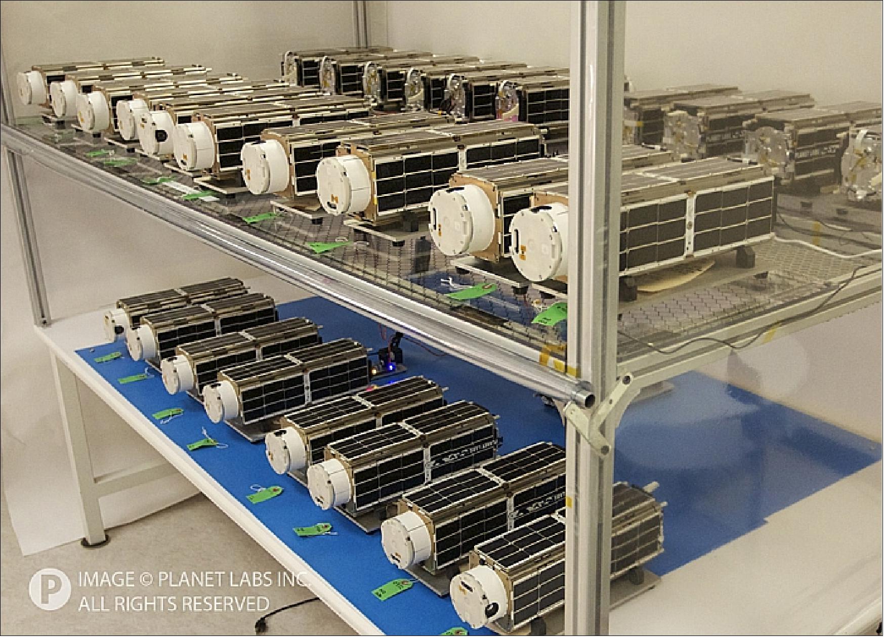 Figure 2: Photo of the 28 Flock 1 nanosatellites before being sent to the launch site (image credit: Planet Labs) 7)