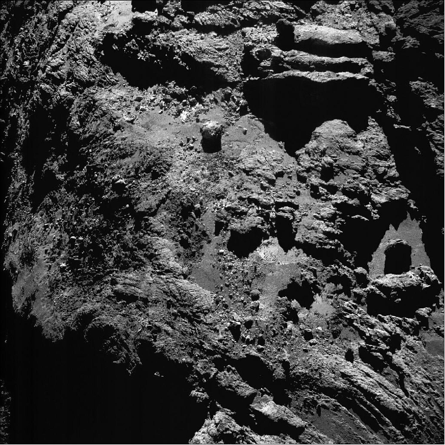 Figure 110: Enhanced NAVCAM image of Comet 67P/C-G taken on 9 July 2016, 11.7 km from the nucleus. The scale is 1 m/pixel and the image measures about 1 km (image credit: ESA/Rosetta/NAVCAM – CC BY-SA IGO 3.0)