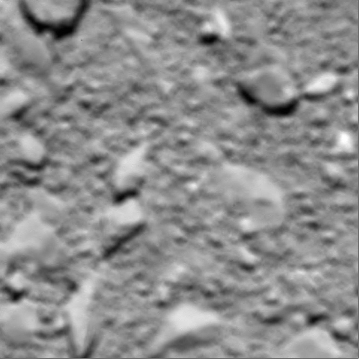 Figure 90: Rosetta's last image of Comet 67P/Churyumov-Gerasimenko, taken with the OSIRIS wide-angle camera shortly before impact, at an estimated altitude of about 20 m above the surface (image credit: ESA/Rosetta/MPS for OSIRIS Team MPS/UPD/LAM/IAA/SSO/INTA/UPM/DASP/IDA)