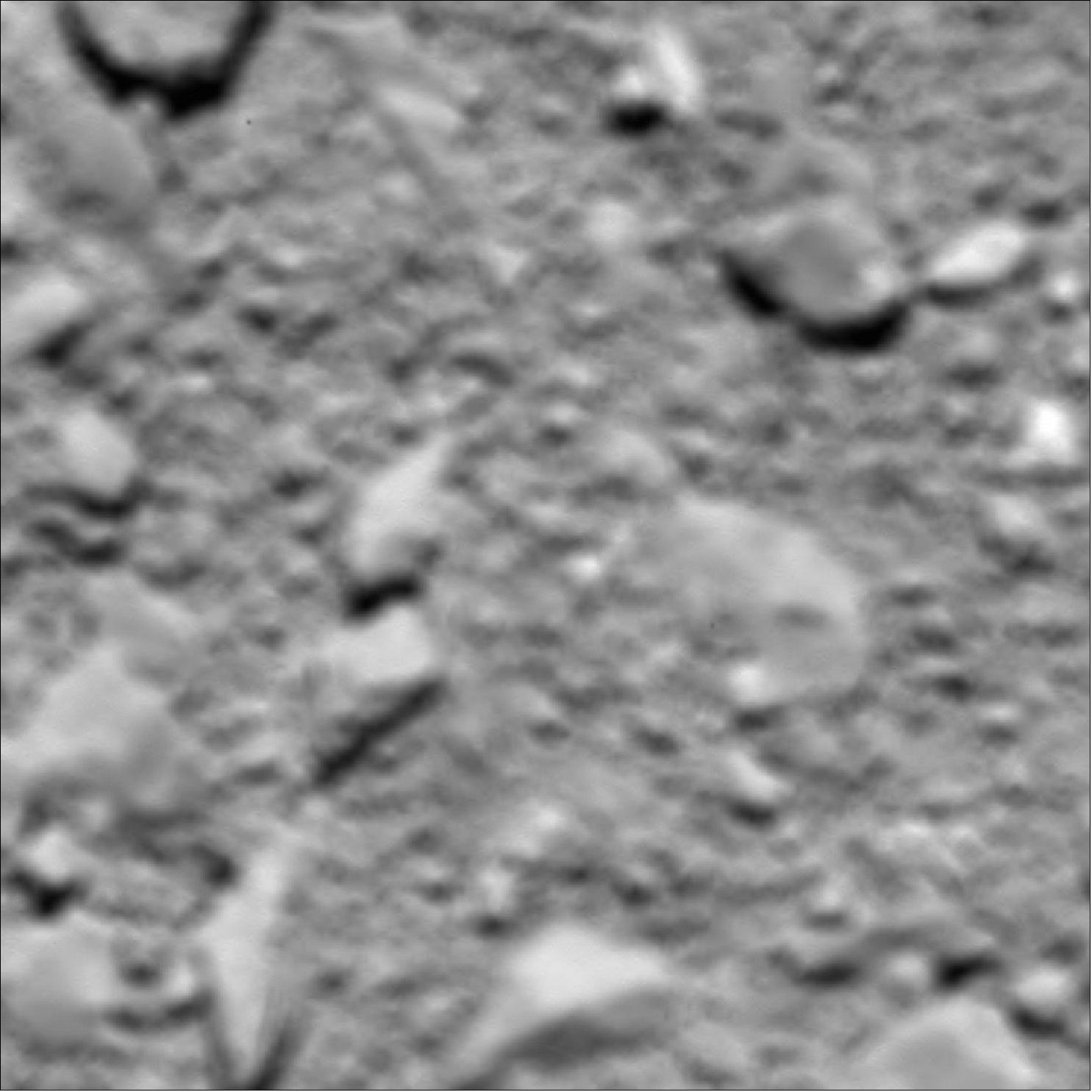 Figure 79: A final image from Rosetta, shortly before it made a controlled impact onto Comet 67P/Churyumov–Gerasimenko on 30 September 2016, was reconstructed from residual telemetry. The image has a scale of 2 mm/pixel and measures about 1 m across (image credit: ESA/Rosetta/MPS for OSIRIS Team MPS/UPD/LAM/IAA/SSO/INTA/UPM/DASP/IDA)