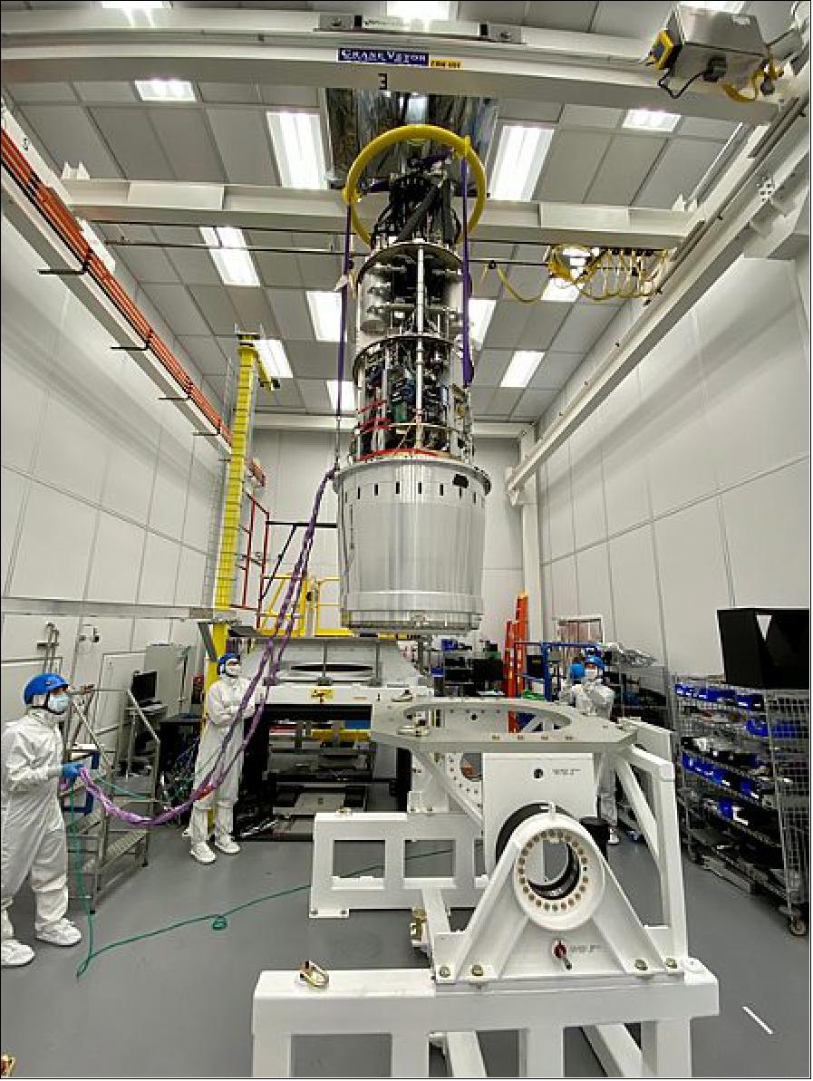 Figure 3: LSST Camera Lift. At SLAC National Accelerator Laboratory, the integrated LSST Camera cryostat and utility trunk was successfully lifted onto its test bench in mid-August. The work was planned and executed by a team that included Rubin staff, SLAC contract assurance, SLAC ES&H and the Bay Area Site Office. This ~$100M assembly is the core of the final camera; it contains the 201 sensors and all the supporting electronics, vacuum and cooling on-camera systems. The installation of this assembly on the test bench will enable completion of the next phase of testing, before further integration of the LSST Camera (image credit: LSST Camera Project, T. Lange)