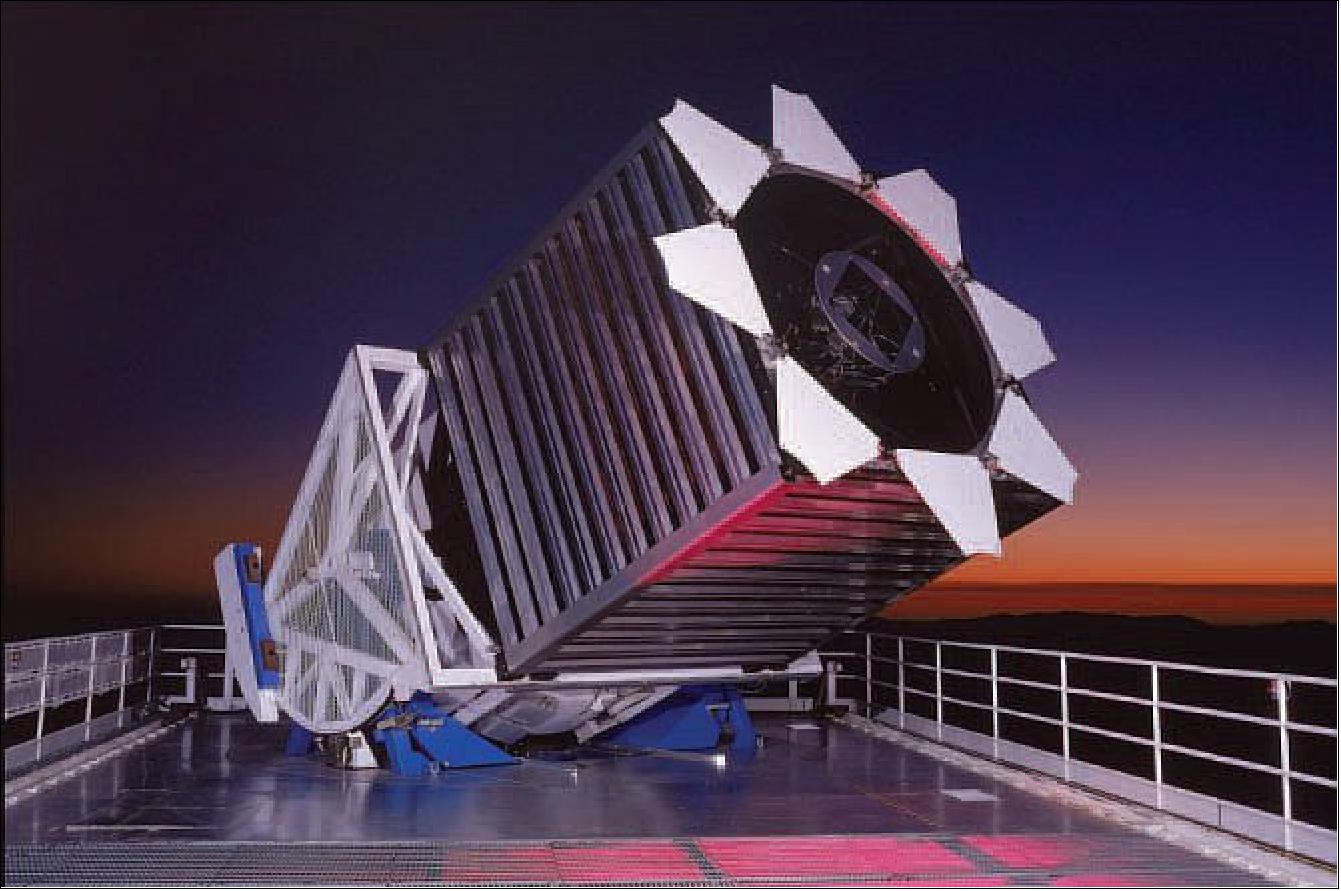 Figure 1: SDSS 2.5 m at sunset, ready for a night’s observing. The picture is taken facing west, with the rolled-off telescope enclosure behind the viewer. The telescope is enclosed in its rectangular wind baffle (image credit: SDSS)