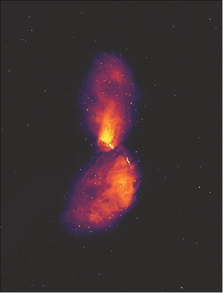 Figure 35: Centaurus A is a giant elliptical active galaxy 12 million light-years away. At its heart lies a black hole with a mass of 55 million suns. This image shows the galaxy at radio wavelengths, revealing vast lobes of plasma that reach far beyond the visible galaxy, which occupies only a small patch at the centre of the image. The dots in the background are not stars, but radio galaxies much like Centaurus A, at far greater distances (image credit: Ben McKinley, ICRAR (International Centre for Radio Astronomy Research) West Australia / Curtin University and Connor Matherne, Louisiana State University)