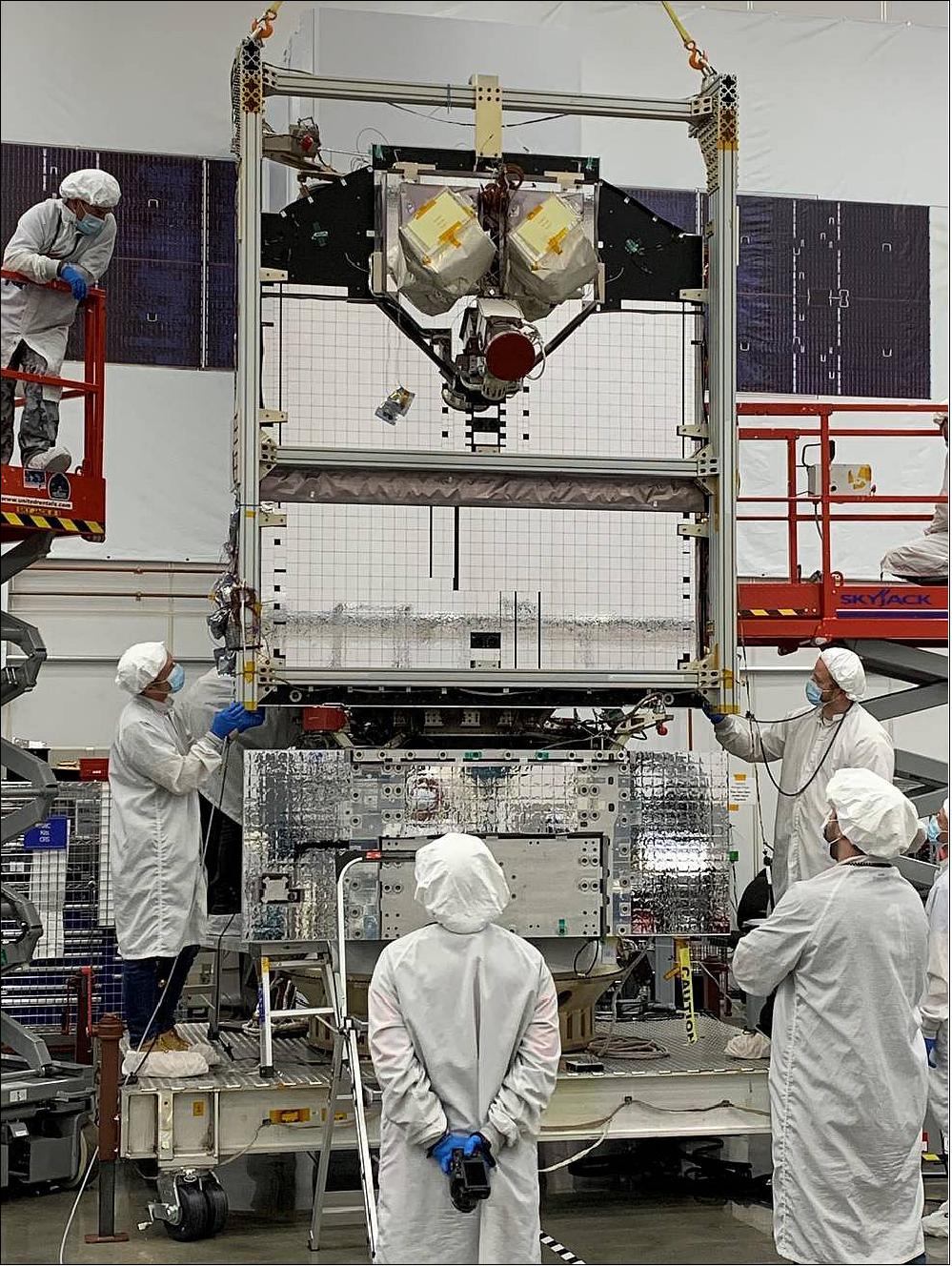 Figure 6: Northrop Grumman technicians in front of the LCRD payload fully installed and integrated on the Space Test Program Satellite (STPSat-6), image credits: NGSS (Northrop Grumman Space Systems)