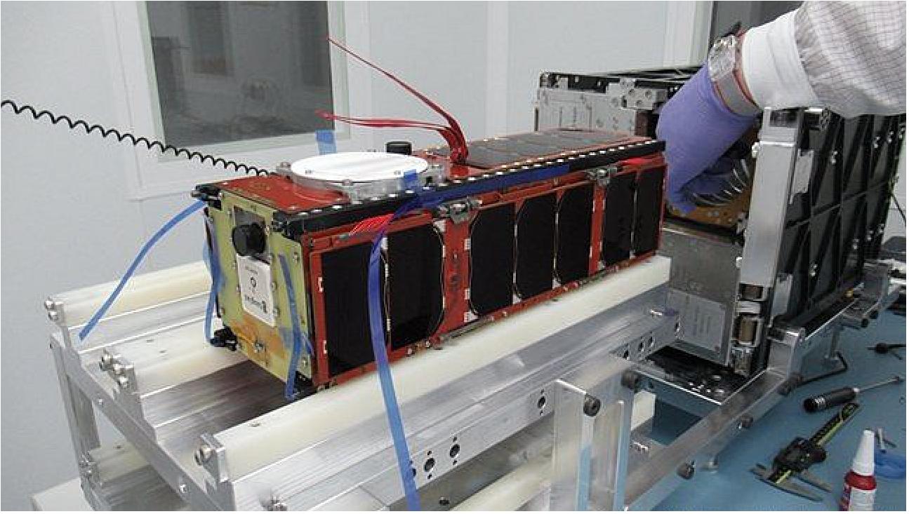 Figure 4: Image of the nanosatellite “Enxaneta”, once placed in the dispenser by the Open Cosmos company staff (image credits: Open Cosmos)
