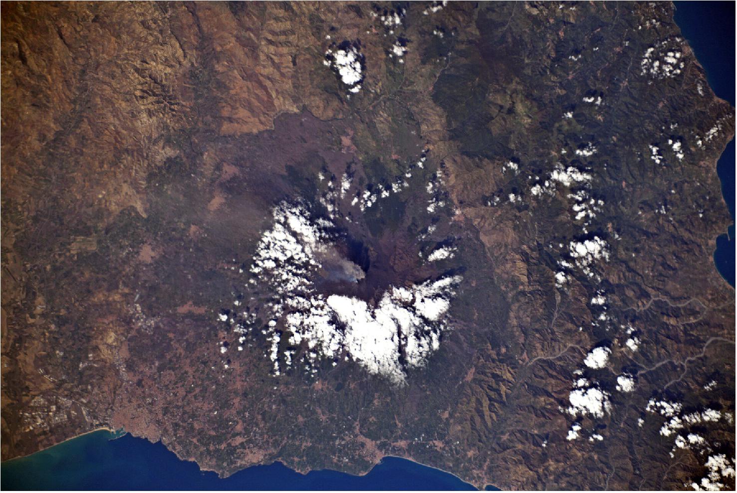 Figure 7: Mount Etna erupting. ESA astronaut Luca Parmitano captured this image of Mount Etna erupting from the International Space Station. Etna is an active stratovolcano on the east coast of Sicily, Italy. Luca was launched to the International Space Station for his second mission, Beyond, on 20 July 2019. He will spend six months living and working on the orbital outpost where he will support more than 50 European experiments and more than 200 international experiments in space (image credit: ESA/NASA-L. Parmitano)