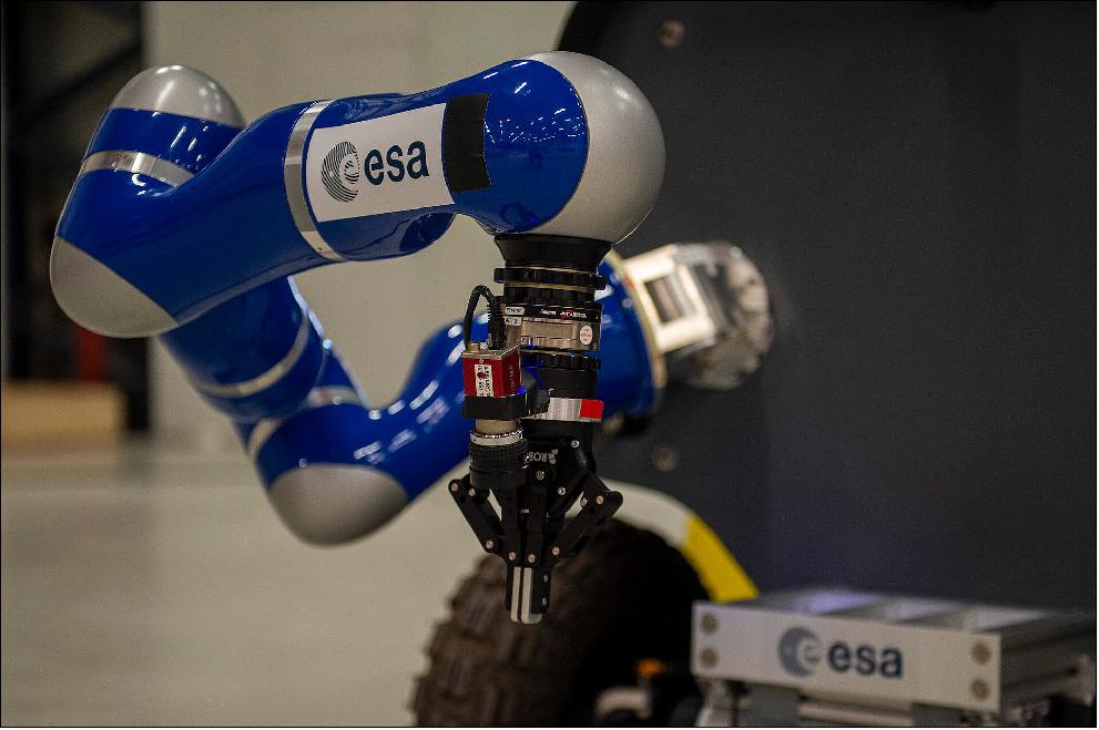 Figure 3: Sample collection gripper on the Analog-1 Interact rover. ESA astronaut Luca Parmitano took command of a rover in the Netherlands on 18 November 2019 and expertly drove it over an obstacle course to a sampling site and collected a rock – all while circling our planet at 28,800 km/h in the International Space Station. - This test was the first in a series to prove the technology ESA has developed to operate rovers from afar. Called Analog-1 the test could hardly have gone any better. Given one hour of precious astronaut time, Luca ticked all the boxes for the exam in less than half an hour. -Robots can be fitted for special tasks and go places where no humans can go, but nothing beats our quick and adaptive thinking and the human touch. The Analog-1 rover is equipped with force feedback so astronauts can feel what the robot feels and adjust grip accordingly on a joystick that allows for six degrees of motion. - ESA's exploration strategy foresees astronauts controlling robots from orbit around the Moon or Mars or from inside a planetary base.- A week later all elements of the overarching Meteron project will be put to the test. Luca will drive the robot to three sites in the hangar in the Netherlands and decide in collaboration with a science team based at the European Astronaut Centre in Cologne, Germany, which rocks to pick up and keep for later analysis. - This experiment is as authentic as possible using the International Space Station as a stand-in for a lunar gateway and the hangar made to resemble a lunar landscape. Whereas the first "proficiency run" was used to test the systems and Luca had to follow a determined path, next week he will be more free to explore to meet the objectives set up by the science team at the European Astronaut Centre. - The same science software designed for guiding the ExoMars rover mission on the Red Planet will be used that allows the science team to indicate sites of interest as well as overlay dangerous areas that are beyond the limits of the rover's capabilities. - The Analog-1 experiment is proving the value of human-robotic cooperation in space and demonstrating the technology that will be used as the basis for many of ESA's exploration projects (image credit: ESA)