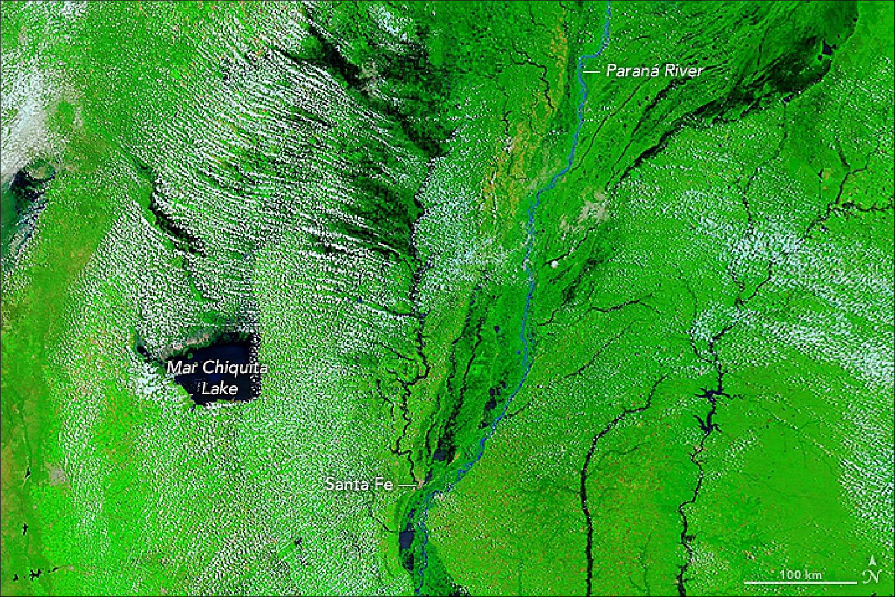 Figure 54: This MODIS image shows the flooding along the Paraná River on 4 February 2019, composed in false color, using a combination of infrared and visible light (MODIS bands 7-2-1). Flood water appears black; vegetation is bright green (image credit: NASA Earth Observatory image by Lauren Dauphin, using MODIS data from NASA EOSDIS/LANCE and GIBS/Worldview. Story by Adam Voiland)
