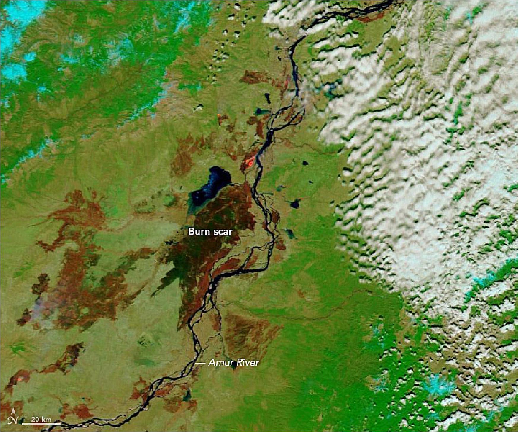 Figure 36: The large burn scar near the center of the image emerged west of the town of Naykhin on April 28, 2019, and then spread rapidly north through swampy grasslands near Lake Bolon. Separate fires that burned within the past few weeks left the scars to the north, west, and south (image credit: NASA Earth Observatory image by Lauren Dauphin, using MODIS data from NASA EOSDIS/LANCE and GIBS/Worldview and using Landsat data from the U.S. Geological Survey. Story by Adam Voiland)