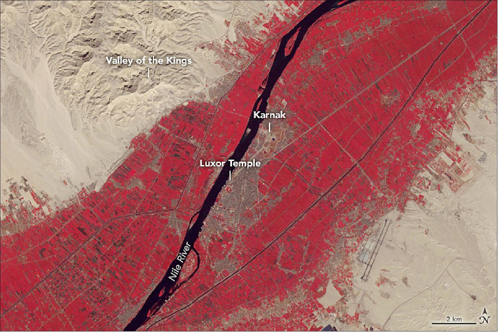 Figure 34: This image of Luxor and its surroundings was acquired on 15 November 2018, by the ASTER (Advanced Spaceborne Thermal Emission and Reflection Radiometer) instrument on NASA’s Terra satellite. This false-color scene is shown in green, red, and near-infrared light, a combination that helps differentiate components of the landscape. Water is black, vegetation is red, and urban areas are brown to gray (image credit: NASA Earth Observatory, image by Lauren Dauphin, using data from NASA/METI/AIST/Japan Space Systems, and U.S./Japan ASTER Science Team. Story by Kasha Patel)