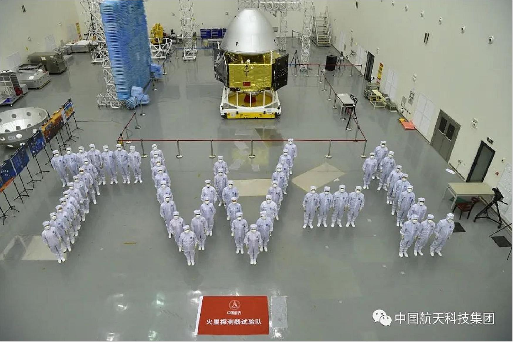 Figure 6: Ground teams pose with the Tianwen-1 spacecraft in its launch configuration, with the mission’s orbiter, lander and rover connected together (image credit: CASC, Ref. 12)