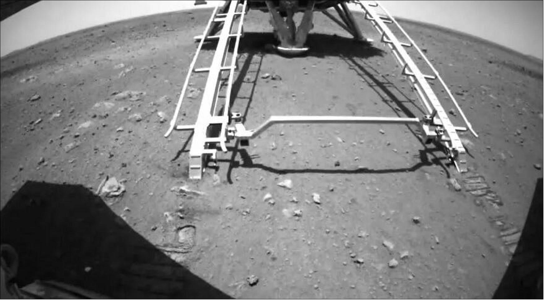 Figure 18: A rear hazard avoidance camera view from Zhurong after deployment from the lander late May 21 EDT, 2021 (image credit: CNSA/PEC)
