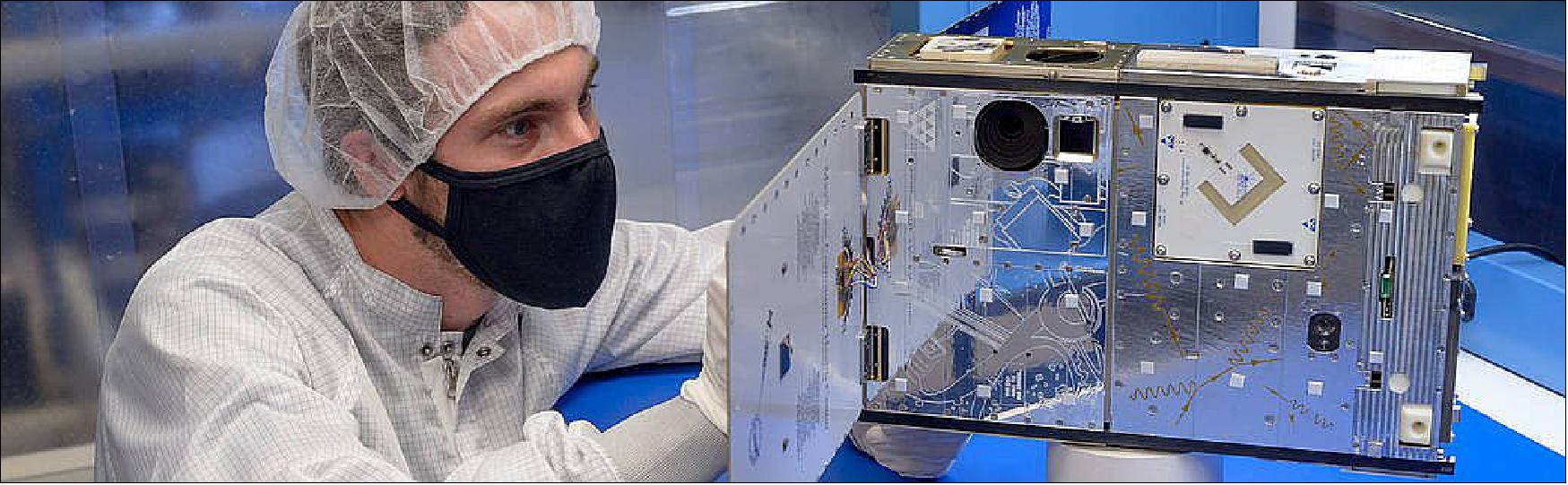 Figure 15: Connor Nelson, PACE flight software lead at NASA's Ames Research Center in California's Silicon Valley, performs a visual inspection of the PACE-1 6U CubeSat during testing (image credit: NASA/Ames Research Center/Dominic Hart)