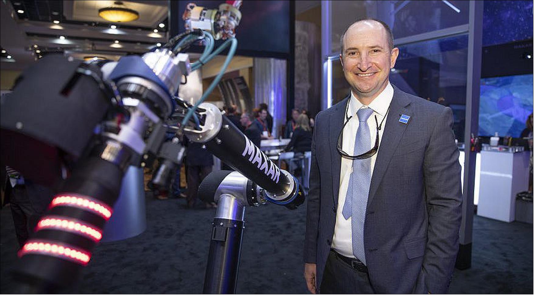 Figure 19: Dan Jablonsky, president and CEO of MAXAR, shown here with a Maxar Space Solutions robotic arm at the 35th Space Symposium at the Broadmoor Hotel in Colorado Springs, CO, April 9, 2019 (photo: Keith Johnson/SpaceNews)